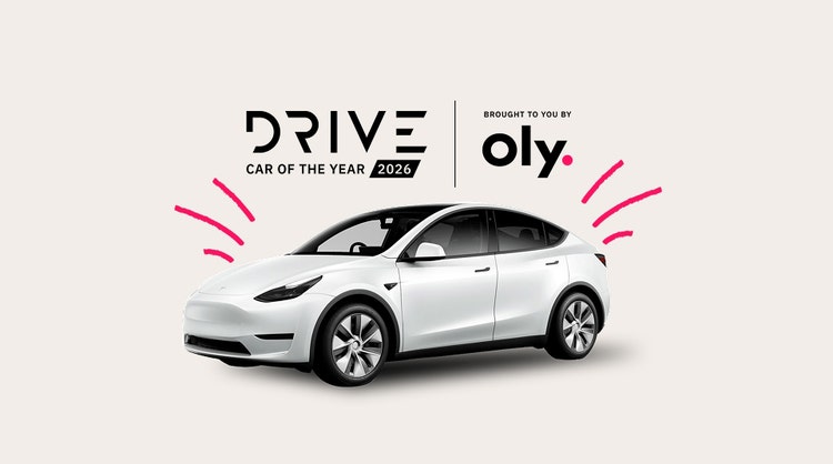 Tesla with Drive Car of The Year 2026 logo and Oly logo.